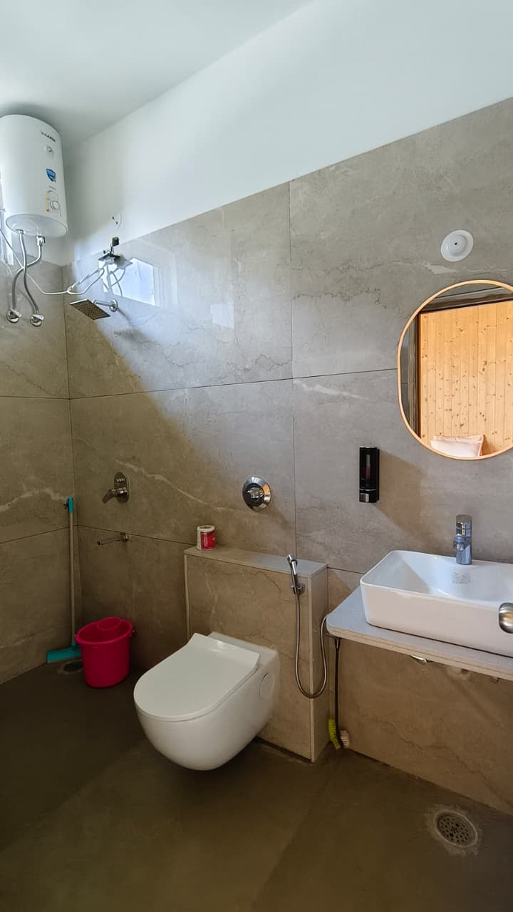 Hotel Dhangauri Uttarkashi elegant riverside facade and lush gardens