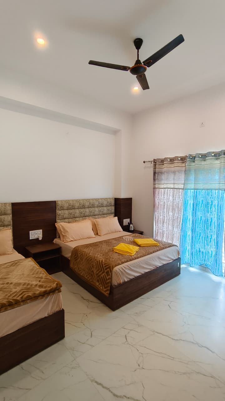 Riverside terrace and balcony at sunset — Hotel Dhangauri