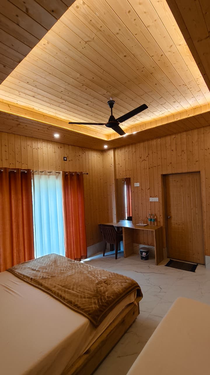 Luxury suite with premium furnishings and panoramic Himalayan view at Hotel Dhangauri